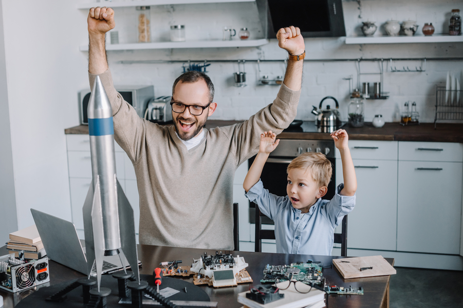 Father and son celebrate their science rocket kit